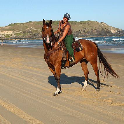 Zoe rides the beach