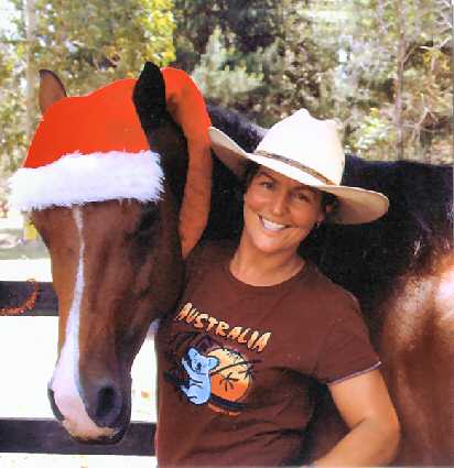 Zoe and horse with red Santa Hat
